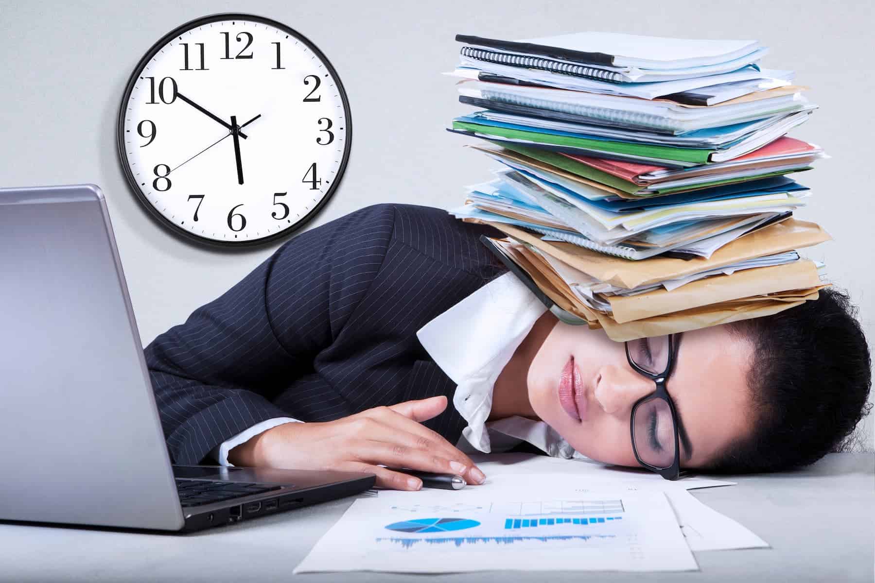 Highly sensitive woman with paperwork over her head feeling exhausted.