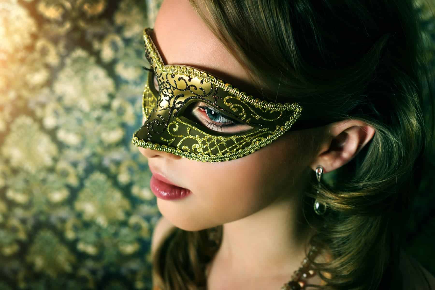 A highly sensitive woman hides behind a mask, concealing her true self — unsure how to overcome imposter syndrome.