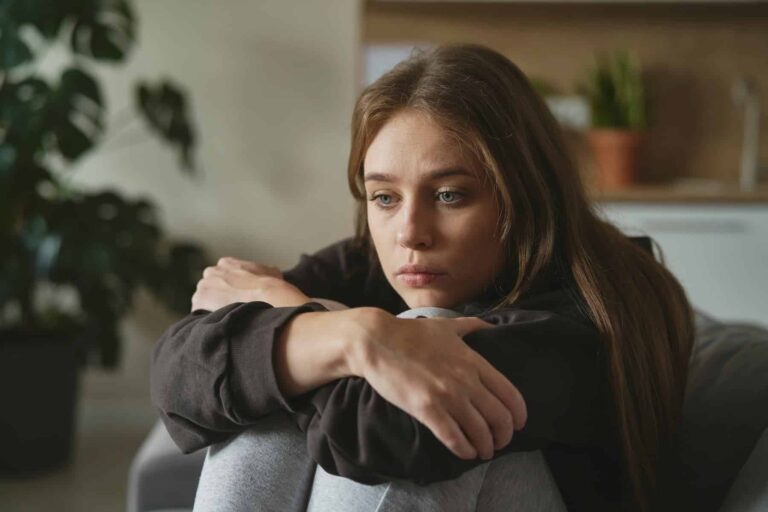 A sad young woman realizes that positive thinking is not enough to reach her goals.