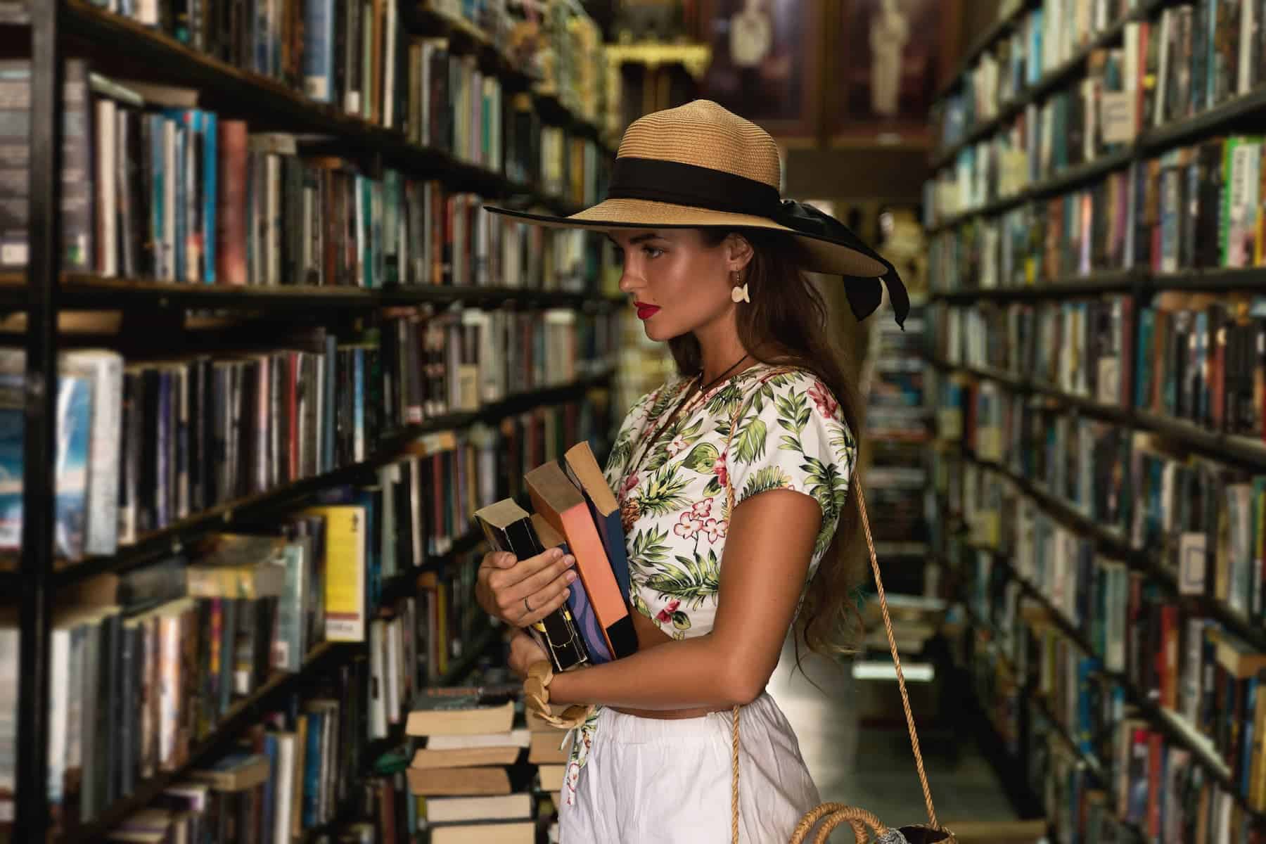 A beautiful girl in a stylish outfit browses for an interesting book in a vintage bookstore, understanding how learning cultivates a growth mindset.