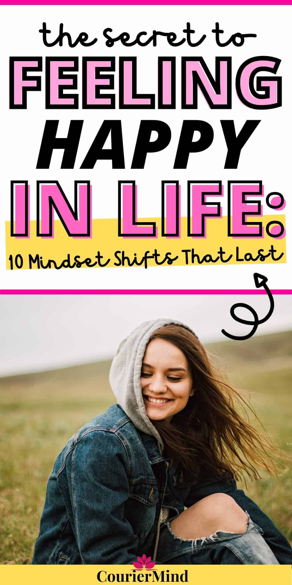 A woman sits on the grass outdoors, smiling as she finds happiness in appreciating life’s little things.