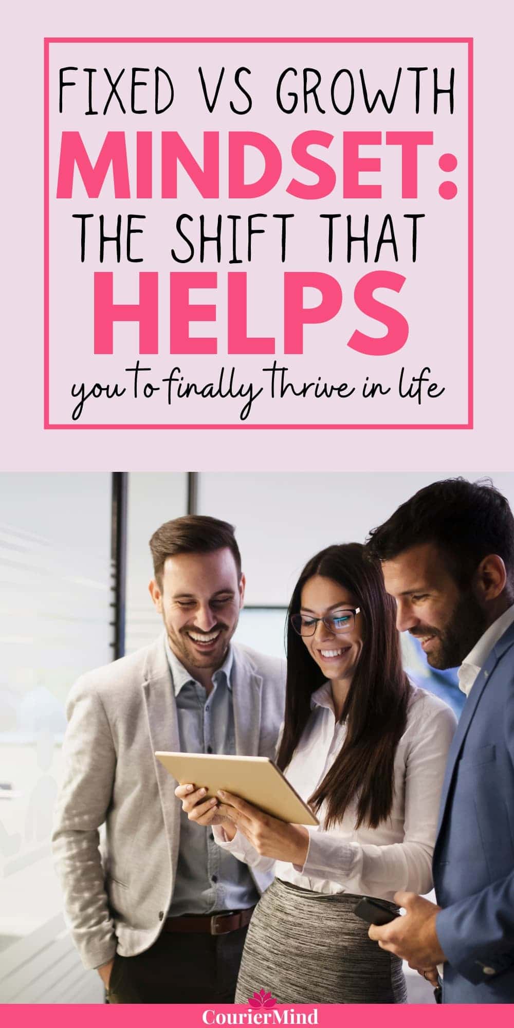Three business professionals look at a tablet and smile, illustrating collaboration and learning — key themes in fixed mindset vs growth mindset.