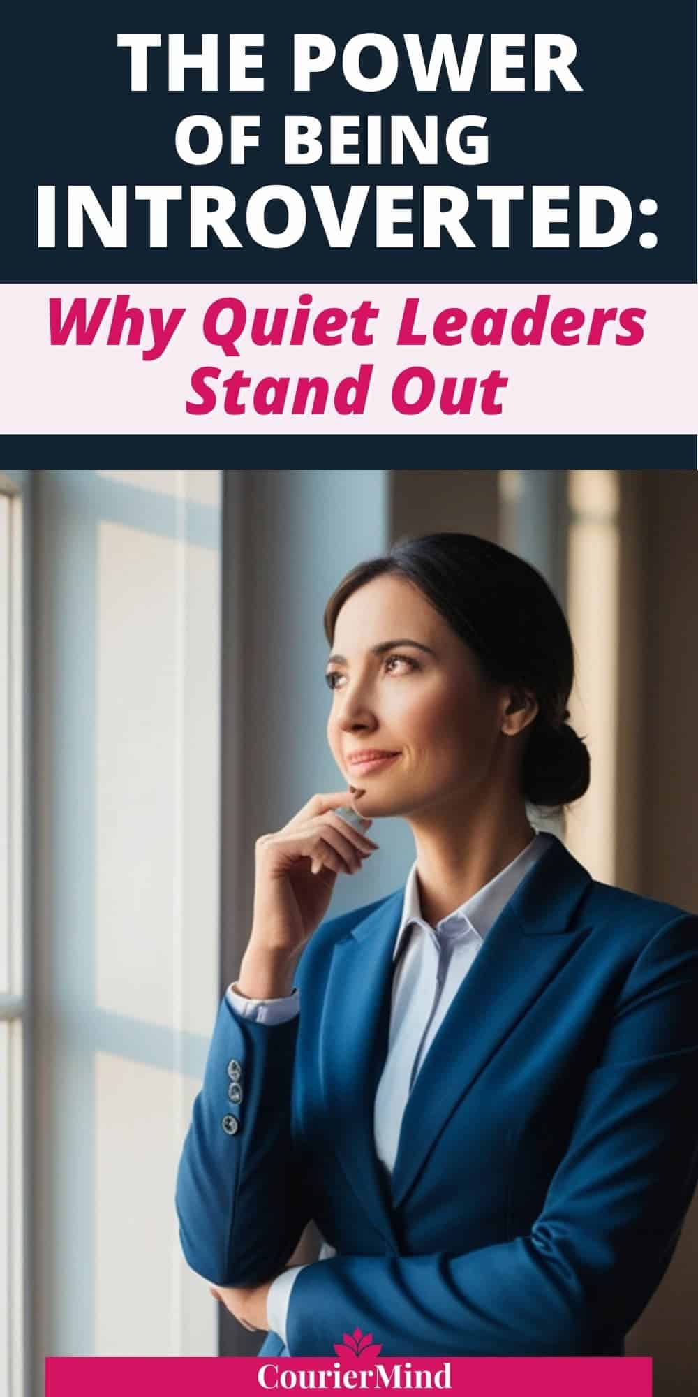 A woman in a blue suit stands by a window, gazing thoughtfully to the side, embodying an introverted and reflective mindset.