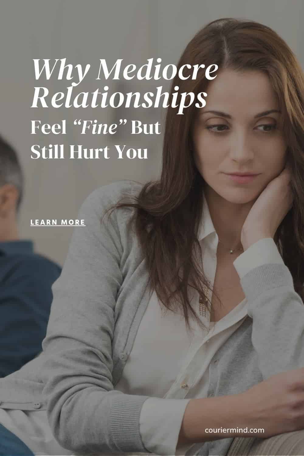 Sad woman looking down with blurred man in background, reflecting emotional distance in mediocre relationships.
