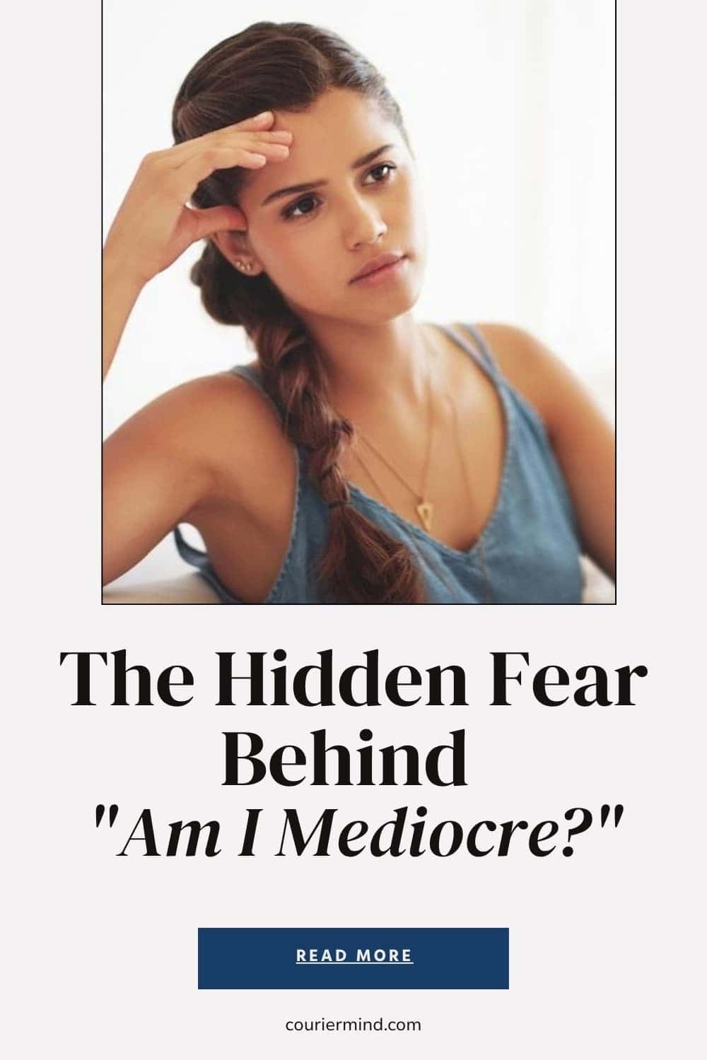 Woman with her hand on her forehead looking off to the side with a pensive expression, wearing a sleeveless denim-like top and a braid.