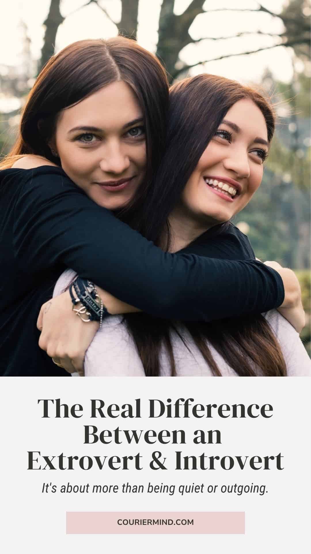 Two sisters embrace while standing in a forest.