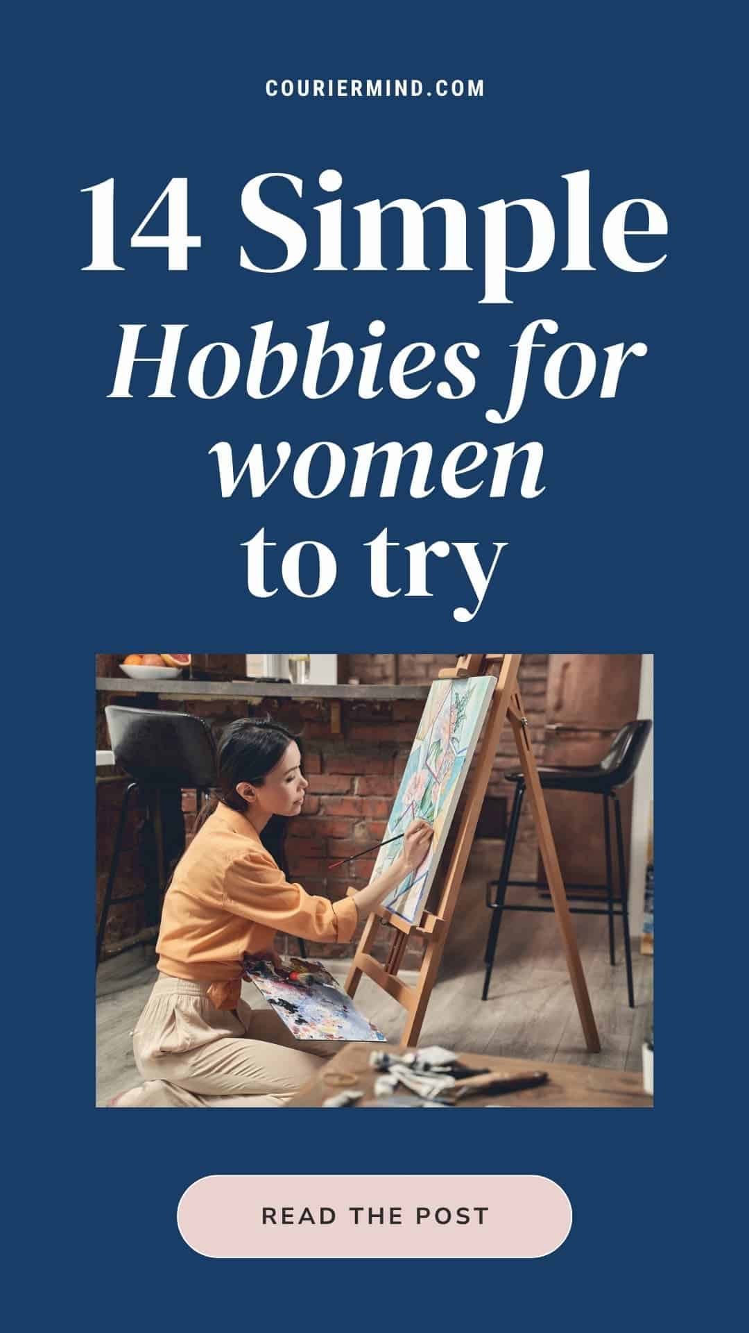 A person sits on the floor and paints with watercolors on an easel in a cozy room with brick walls.